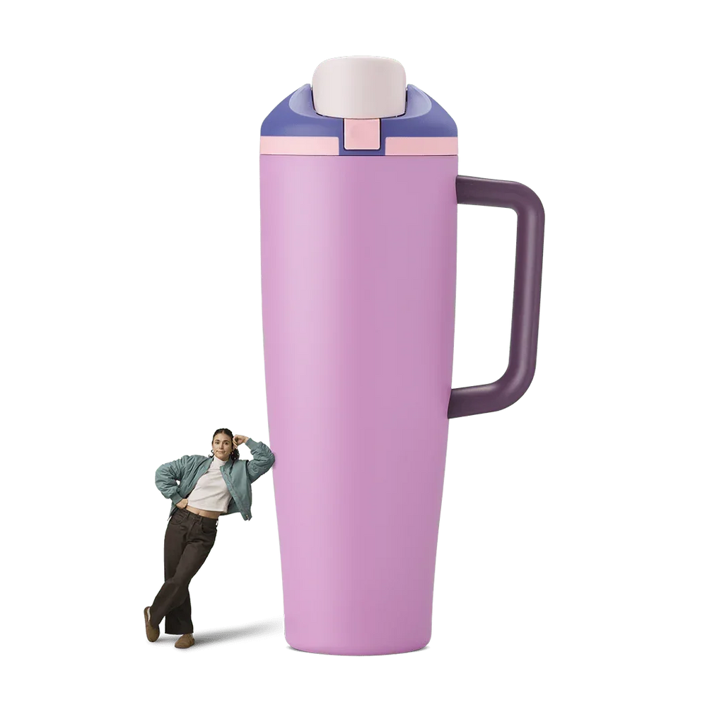 40oz Pretty In Purple Miami Tumbler with side handle and flip-top lid standing next to woman