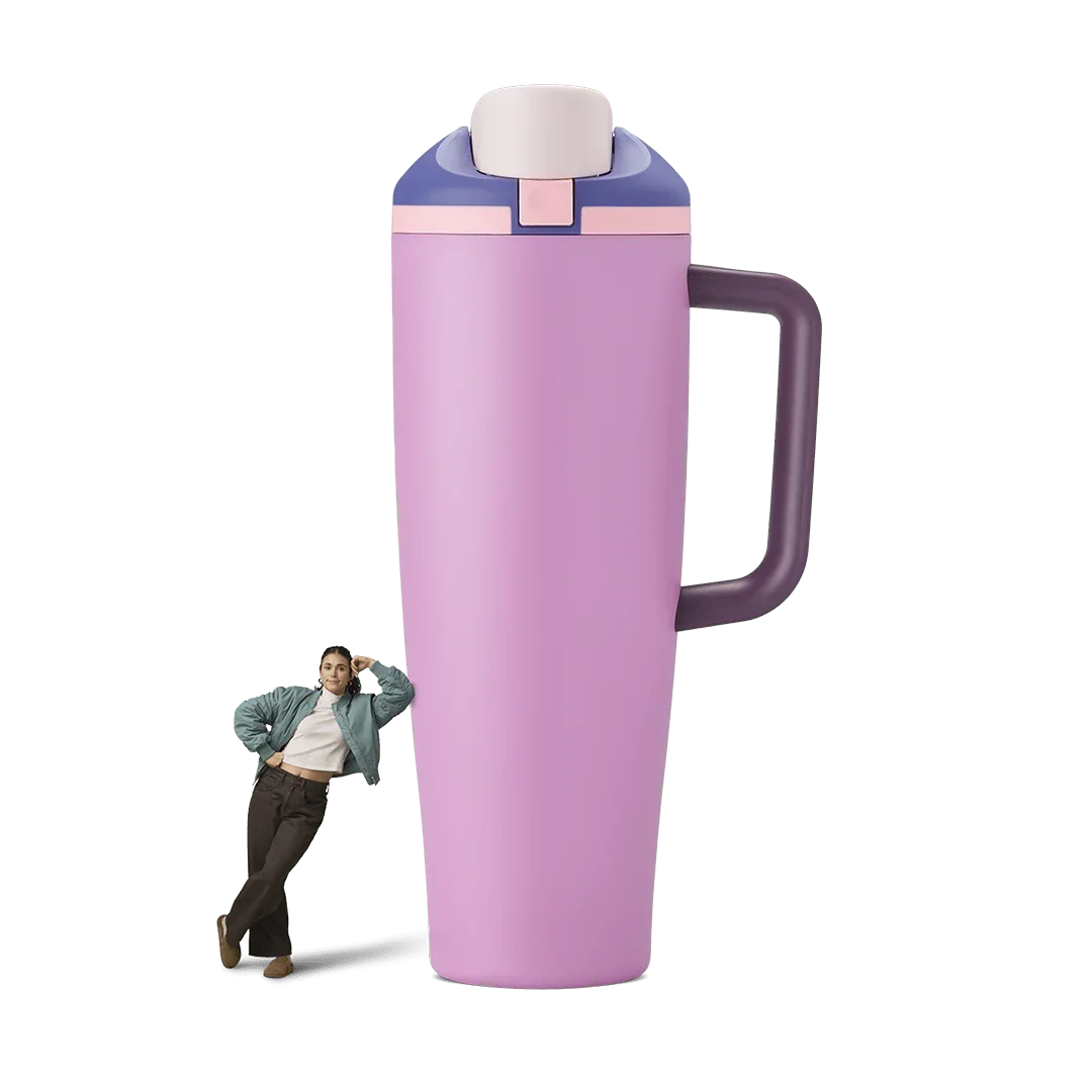 40oz Pretty In Purple Miami Tumbler with side handle and flip-top lid standing next to woman