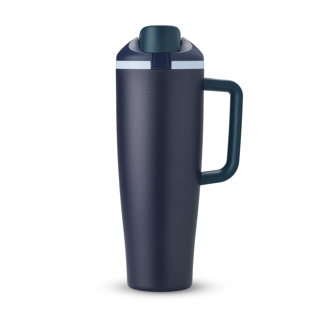 Tall navy blue insulated travel tumbler with flip-top lid and right-hand handle