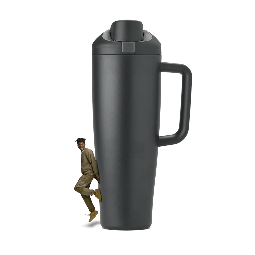 Tall black 40oz Miami tumbler with handle and flip lid, shown with a smiling man beside it
