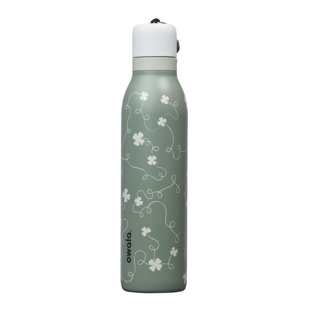 24oz Owala insulated water bottle in clover green with white floral print and spill-proof cap