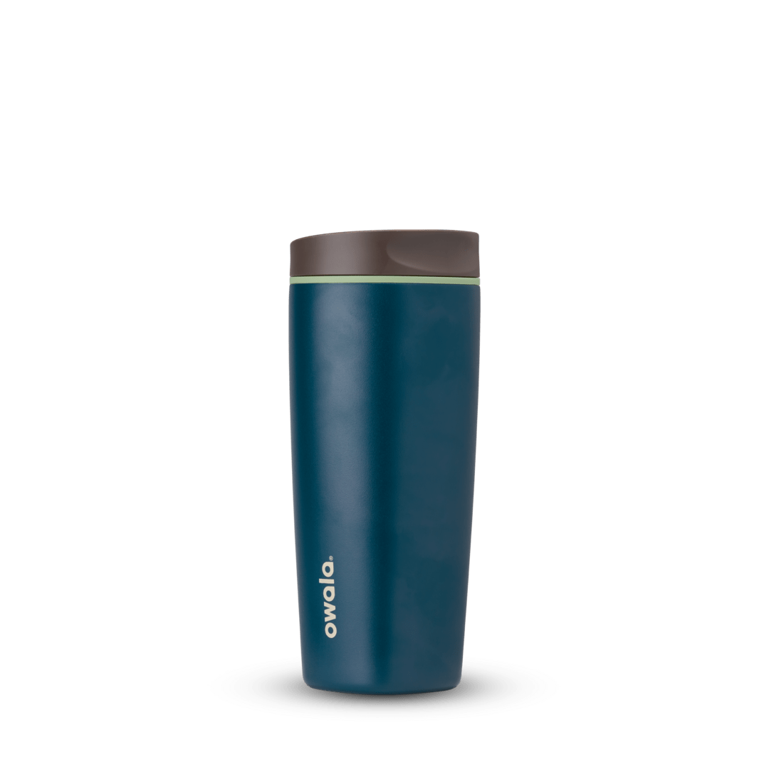 Blue Owala travel tumbler with brown lid on white background