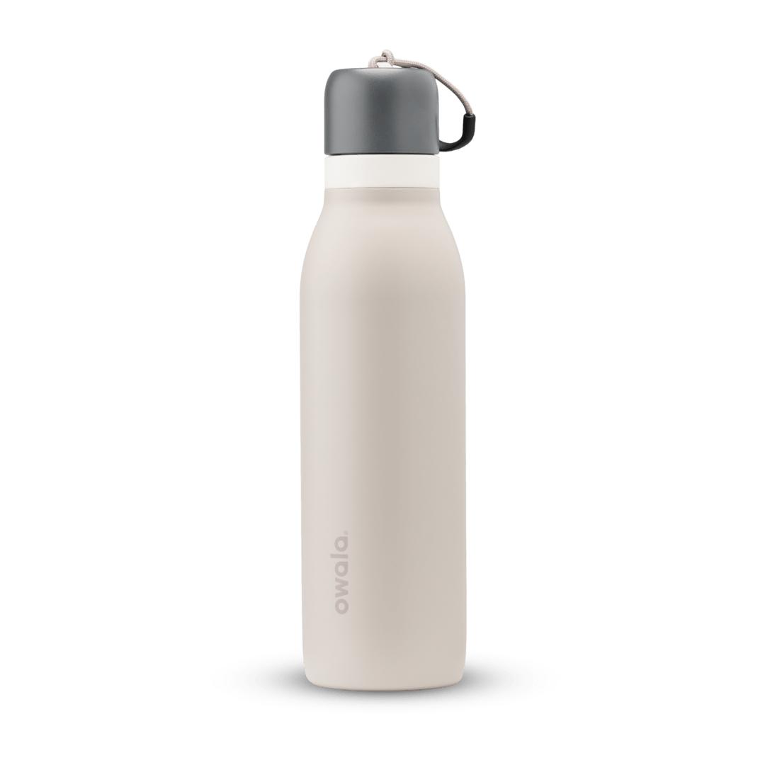Owala insulated 18oz beige water bottle with gray screw cap and carrying loop