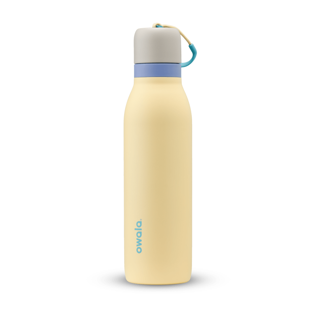 Owala 18oz insulated water bottle in pale yellow with blue accents and carrying loop