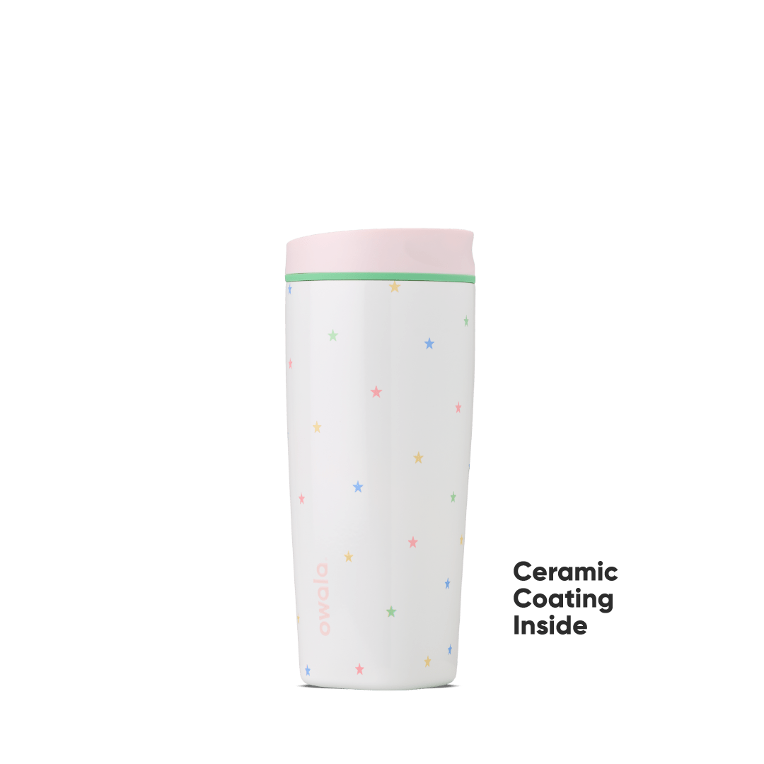 White Owala travel tumbler with colorful star pattern and pink lid featuring ceramic coating